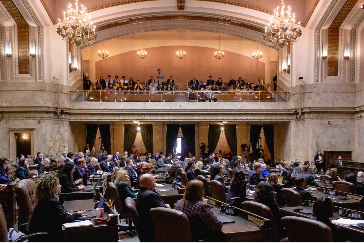 State representatives sit in the House chamber on the first day of the 2026 legislative session. (Photo by Jacquelyn Jimenez Romero/Washington State Standard)